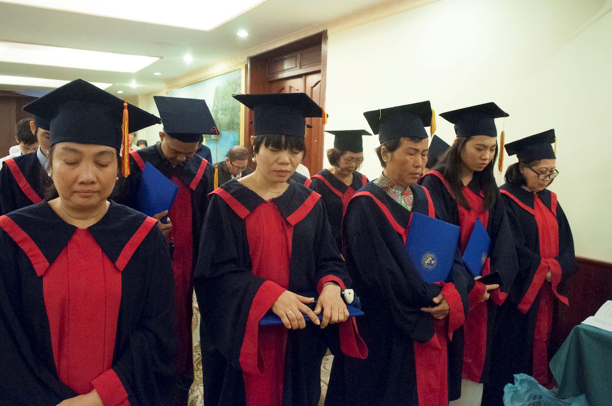 graduates praying