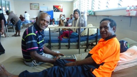 Chaplain Taime with patient