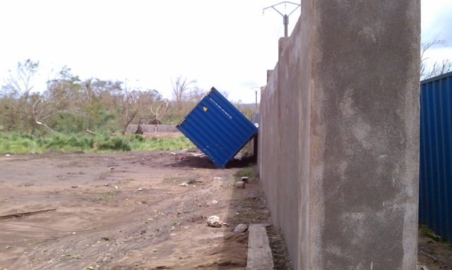 The storm ended up rolling the 40' shipping container across the ground into a wall.