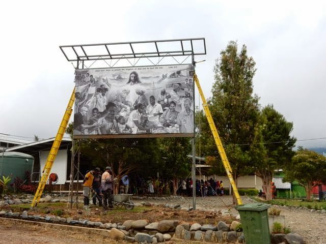 Mural being erected alongside the outpatient waiting area at Kudjip Nazarene Hospital. 